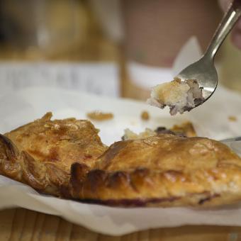 Up close shot of someone trying pasty